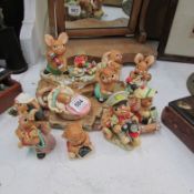 A Pendelfin stand and 10 Pendelfin rabbits