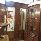 An Edwardian mahogany mirror door wardrobe