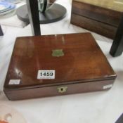 A mahogany writing box with brass inlay and inkwell
