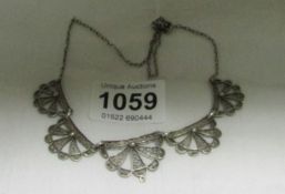 A silver filgree necklace