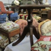 A mahogany circular pedestal table