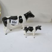 A Beswick cow (a/f) and calf