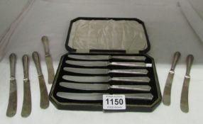 A cased set of 6 silver handled butter knives and 6 odd ones