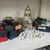 A Thimble stand and large collection of thimbles