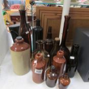 A quantity of glass and stoneware bottles