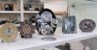 3 photo frames, 2 clocks and one other item