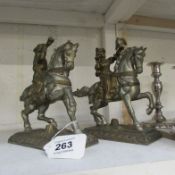 A pair of spelter figures on horses