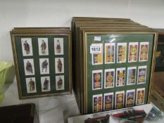 A quantity of framed military cigarette cards