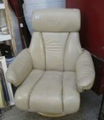 A cream leather adjustable arm chair