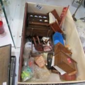 A box of vintage wood and metal doll's house furniture