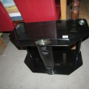 A black glass TV stand