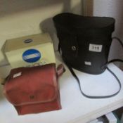 A Minolta box camera, a box Brownie and binoculars