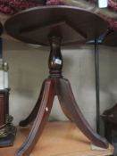 A mahogany circular pedestal table