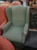 A green wing armchair