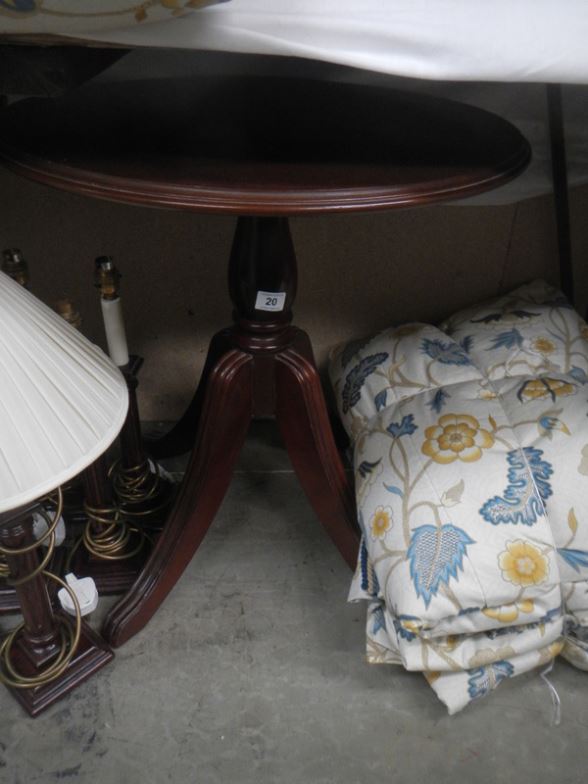 A mahogany circular pedestal table