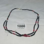 A 150ct African ruby and sapphire 2 section necklace
