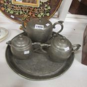 A Kui Hing pewter tea set on tray