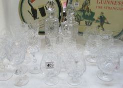 2 cut glass decanters and various wine and brandy glasses