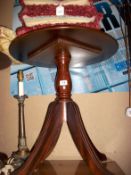 A mahogany circular pedestal table