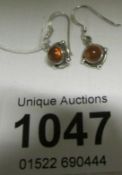 A pair of silver and amber earrings