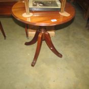 A mahogany circular pedestal table