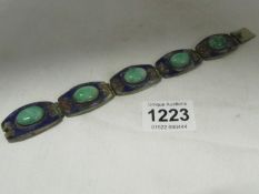 A 20c Oriental bracelet with jade stones