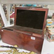 A Victorian mahogany writing slope with secret drawers