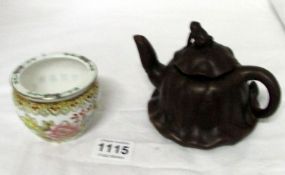 A Chinese teapot with frog on lid and a small pot