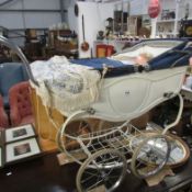 A coach built doll's pram with doll