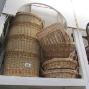 A wicker linen basket and other baskets