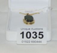 A 14ct gold ammonite and diamond set pendant