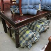 A dark wood rustic dining table