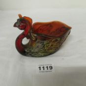 An unusual red coloured dish in the shape of a chicken