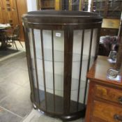 A domed front china cabinet
