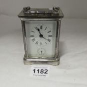 A silver plate carriage clock