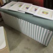 An upholstered blanket box