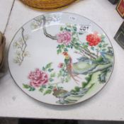 An Oriental plate featuring birds of paradise