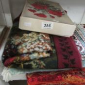 A mixed lot of embroideries, rugs etc