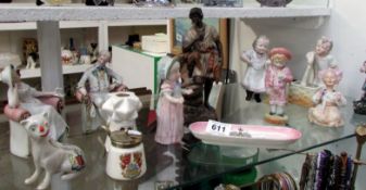 A mixed lot of figurines and Crested ware