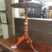 A mahogany tripod table