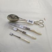 A silver pickle fork, plated salad tongs, fork and knife