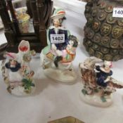 3 Staffordshire figures including girl riding goat