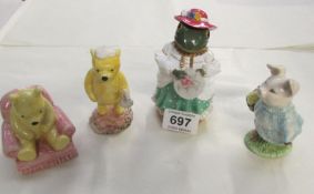 2 Royal Doulton Winnie The Pooh figures, A Royal Albert Beatrix Potter Little Pig Robinson and one