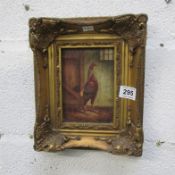 A gilt framed print of a cockerel