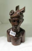 A carved wood bust