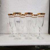 A set of 6 gold rimmed champagne flutes