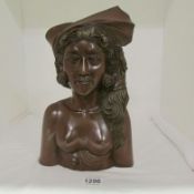 A carved wood Oriental bust