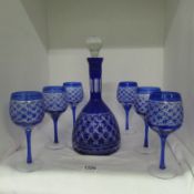 A Bohemian blue overlaid cut glass decanter and 6 glasses