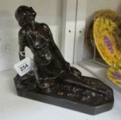 A plaster reclining figure signed J Jackson, dated 1945