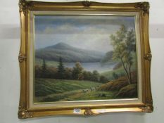 An oil on canvas of hill, lake and shepherd with sheep signed P Wilson